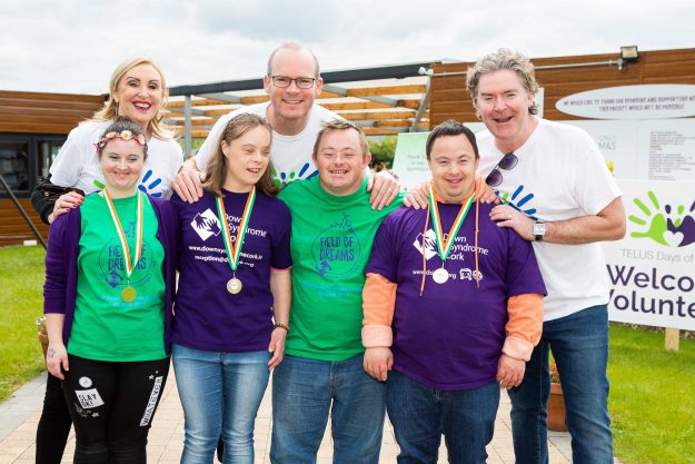 19/05/2019 – REPRO FREE Field of Dreams participants Mariah Couch, Maeve Owens, John Kenneally, and Alan Carroll, pictured with (Back L-R) Linda Kiely, co-founder of Voxpro; Tánaiste Simon Coveney TD, and Dan Kiely, co-founder of Voxpro, at the “Telus Day of Giving” hosted by Voxpro – Powered by Telus International, at the Down Syndrome Cork Field of Dreams site, where almost 400 Voxpro Employees helped transform the site into a commercial growing space in a single day on Saturday. Picture: Michael O’Sullivan / OSM PHOTO