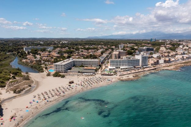 Aerial Drone Photo Of The Beach Front On The Spanish Island Of Majorca Mallorca, Spain Viewed From A