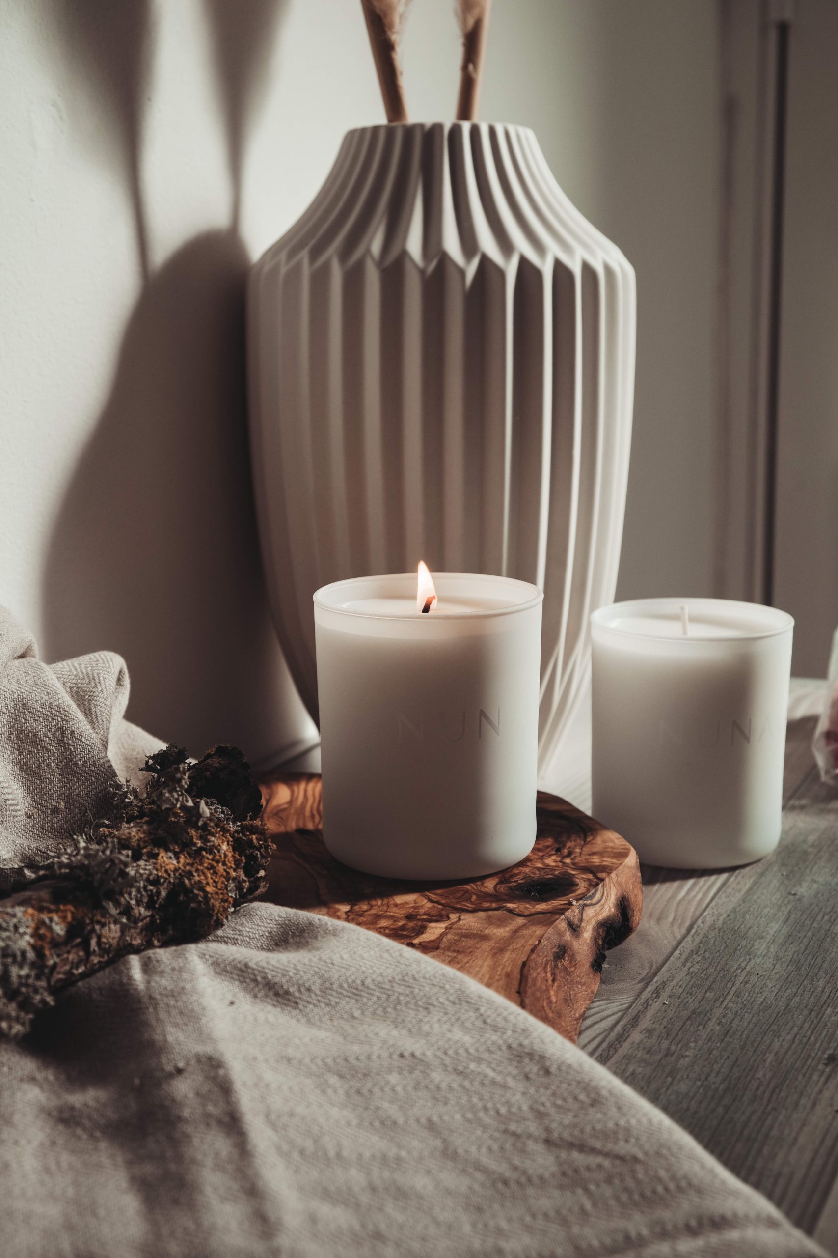 Nunaia Beauty Sacred Space Candle Burning on table close up ©2022