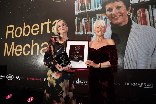 Arlene Mechan, daughter-in-law of Roberta Mechan presented with the Outstanding Contribution to the Industry trophy from Pamela Ballantine on behalf of NI Beauty Excellence Awards